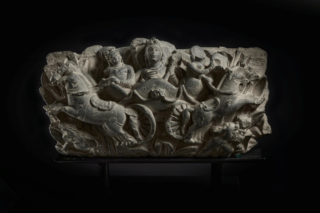 View full screen - View 1 of Lot 812. A gray schist relief of Surya atop his chariot, Ancient region of Gandhara, 3rd century.