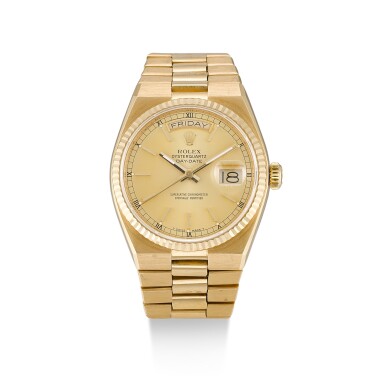 View full screen - View 1 of Lot 132. ROLEX | OYSTERQUARTZ DAY-DATE, REFERENCE 19018, A YELLOW GOLD BRACELET WATCH WITH DAY AND DATE, CIRCA 1986.