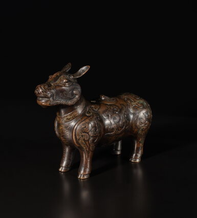 View full screen - View 1 of Lot 333. An archaistic silver-inlaid bronze figure of a tapir, Ming dynasty | 明 銅錯銀犧尊.