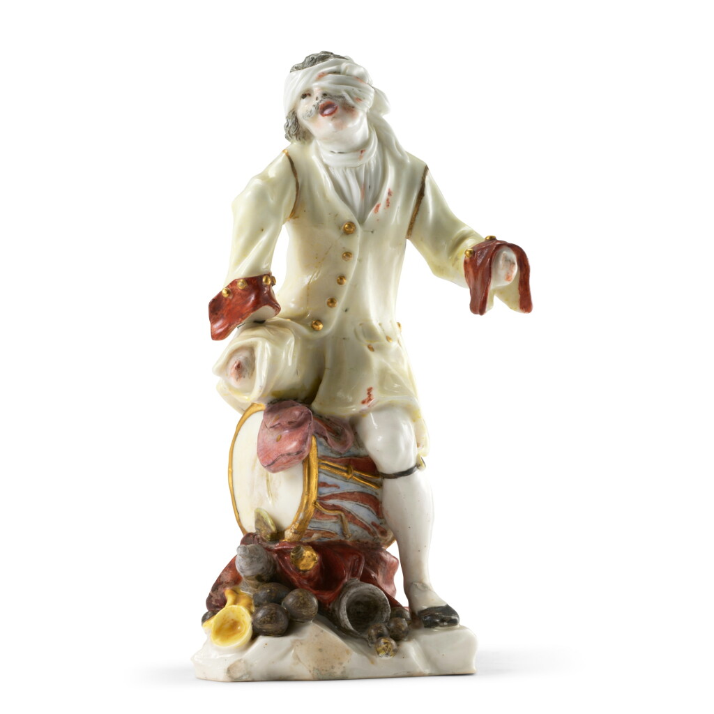 View full screen - View 1 of Lot 103. A very rare Capodimonte porcelain figure of a mutilated soldier, circa 1750-55 .