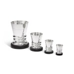 A set of 4 silver and ebony increasing size beakers, Eschwège, Paris, circa 1950 | Ensemble de quatre timbales en argent de taille croissante sur base en ébène du Gabon par Eschwège, Paris, vers 1950