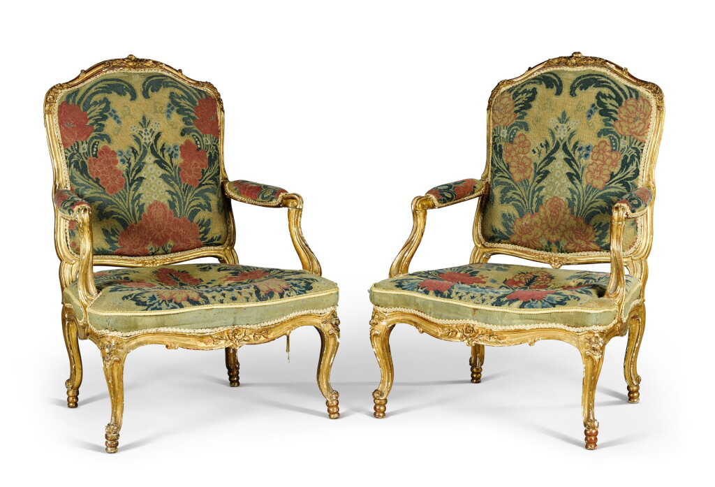 View full screen - View 1 of Lot 105. A pair of Louis XV carved giltwood fauteuils, by Michel Cresson, mid-18th century.