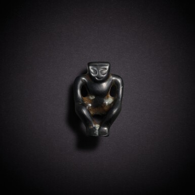 View full screen - View 1 of Lot 7809. A black jade figure, Neolithic period, Hongshan culture | 新石器時代 紅山文化 墨玉坐人像.