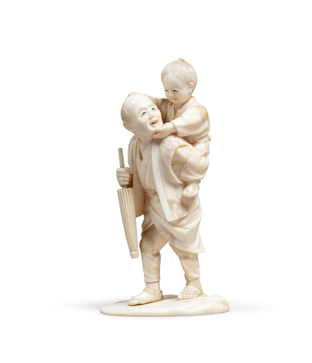 View full screen - View 1 of Lot 181. An ivory okimono of a man carrying a child Japan, Meiji period, 1868-1912 | Okimono en ivoire d'un homme portant un enfant Japon, époque Meiji, 1868-1912.