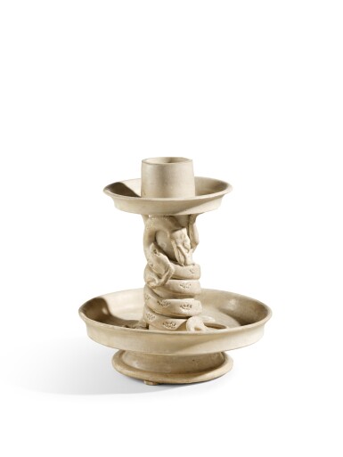 View full screen - View 1 of Lot 2057. A rare white-glazed 'chilong' candle holder, Early Tang dynasty | 唐初 白釉塑貼蟠螭紋燭台.