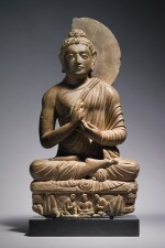 A GREY SCHIST FIGURE OF THE SEATED BUDDHA, ANCIENT REGION OF GANDHARA, 3RD/4TH CENTURY