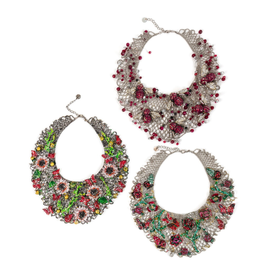 View full screen - View 1 of Lot 136. A set of three painted metal, strass and colored glass pearls necklaces, modern.