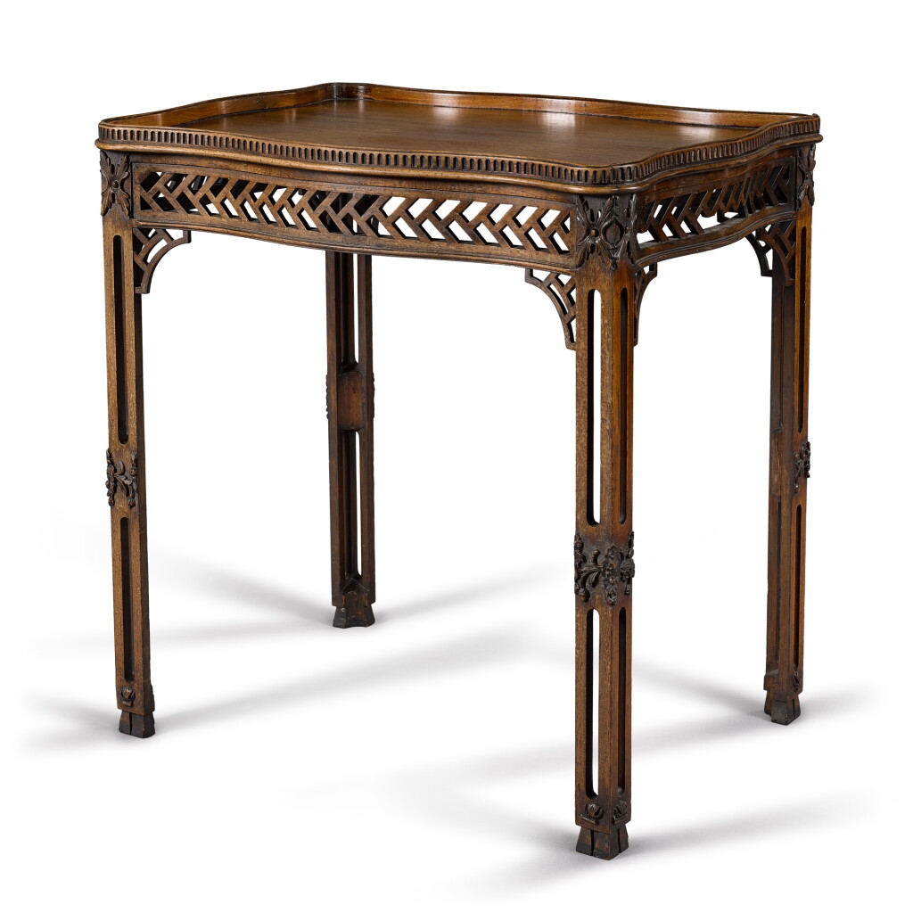 View full screen - View 1 of Lot 27. A George III mahogany serpentine silver table, circa 1770.