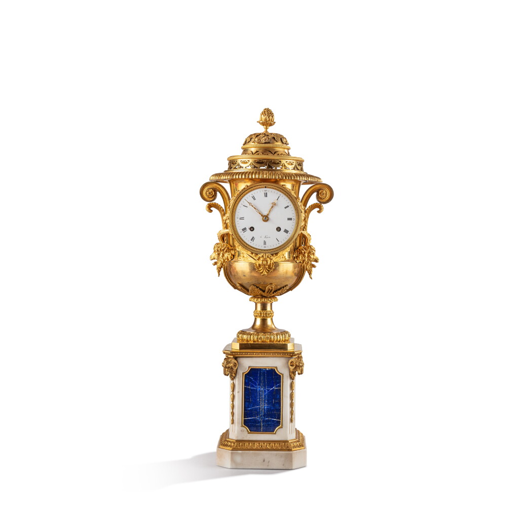 View full screen - View 1 of Lot 700. A Directoire gilt-bronze mounted marble and lapis lazuli clock, circa 1800, after a model attributed to Claude Galle or Pierre-Philippe Thomire.