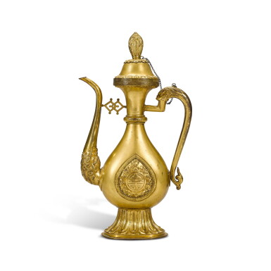 View full screen - View 1 of Lot 365. A gilt-bronze 'shou' ewer and cover, Qing dynasty, 18th century | 清十八世紀 鎏金銅開光壽紋龍柄執壺連蓋.