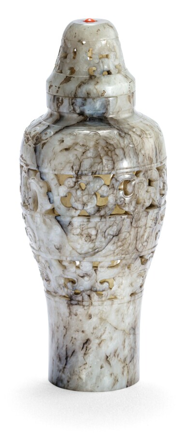 View full screen - View 1 of Lot 51. VASE COUVERT ARCHAÏSANT EN JADE AJOURÉ 'CHICKEN BONE' FIN DE LA DYNASTIE MING - DÉBUT DE LA DYNASTIE QING | 明末至清初 雞骨白玉鏤雕仿古紋蓋瓶 | A reticulated 'chicken bone' jade vase and cover, late Ming Dynasty- early Qing Dynasty.