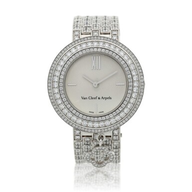 View full screen - View 1 of Lot 159. Mini Charms, A white gold and diamond-set bracelet watch, Circa 2013.
