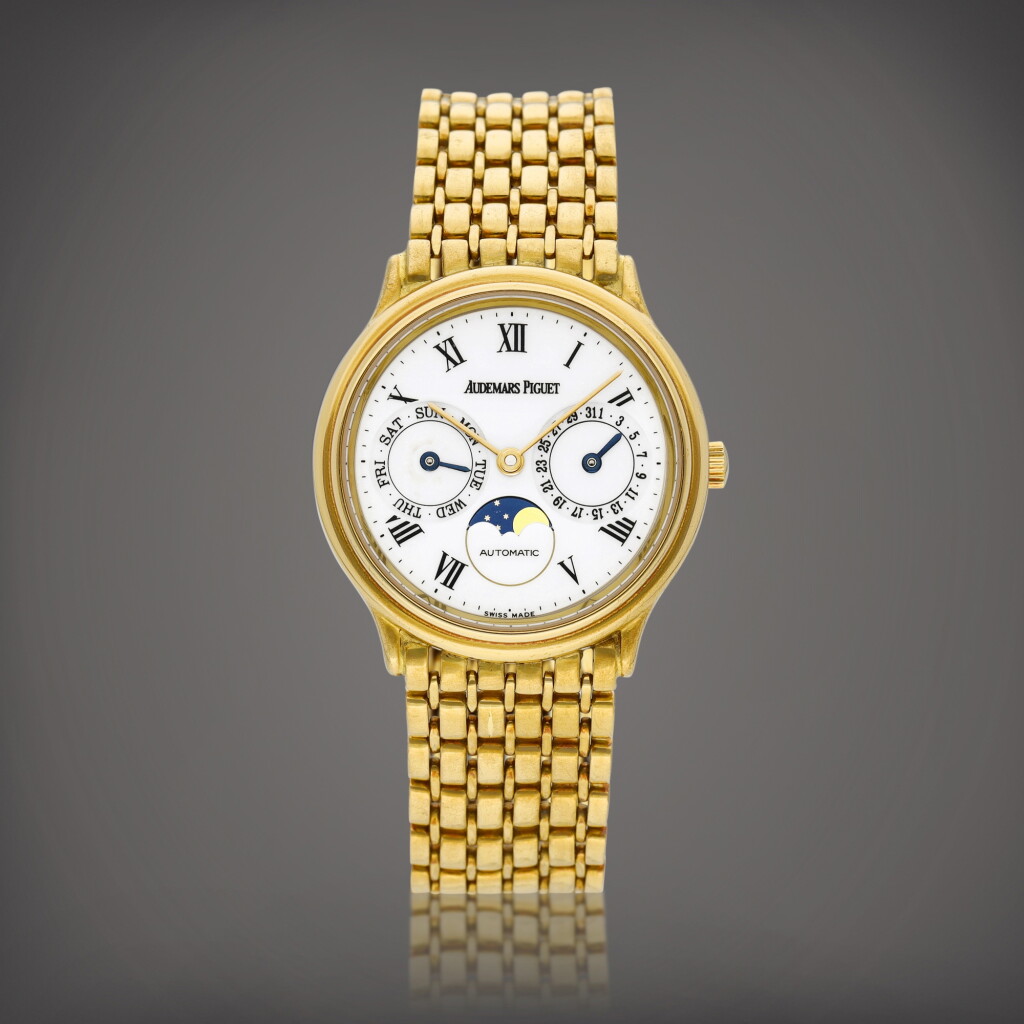View full screen - View 1 of Lot 8701. Reference 25589BA | A yellow gold bracelet watch with day, date, moon phases and enamel dial, Circa 1985 | 愛彼 | 型號25589BA | 黃金鏈帶腕錶,備日期、星期、月相顯示及琺瑯錶盤,約1985年製.