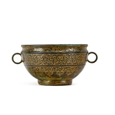 View full screen - View 1 of Lot 301. An oval bronze handled vessel, Eastern Zhou dynasty, Spring and Autumn period, the gilded decoration applied in the 20th century 東周春秋時期 銅夔龍紋敦 描金為二十世紀後加.