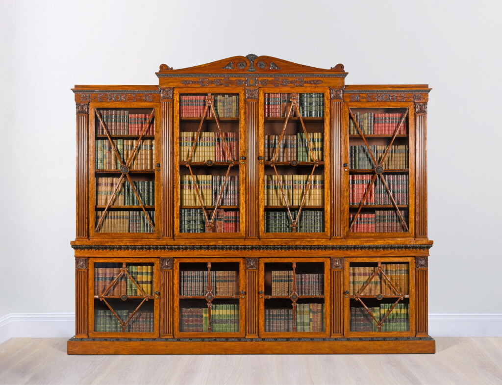 View full screen - View 1 of Lot 88. A Regency fiddle-back mahogany library bookcase, circa 1815.
