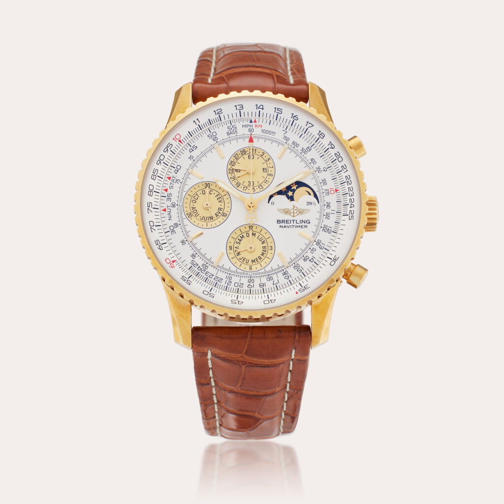 View full screen - View 1 of Lot 212. Reference K1934012/G524 Navitimer Olympus | A limited edition pink gold automatic chronograph wristwatch with date, moon phases and French day and month, Circa 2001.