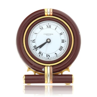 View full screen - View 1 of Lot 128. Reference 7522, A tri-color gold plated desk clock with alarm, Circa 1980 .