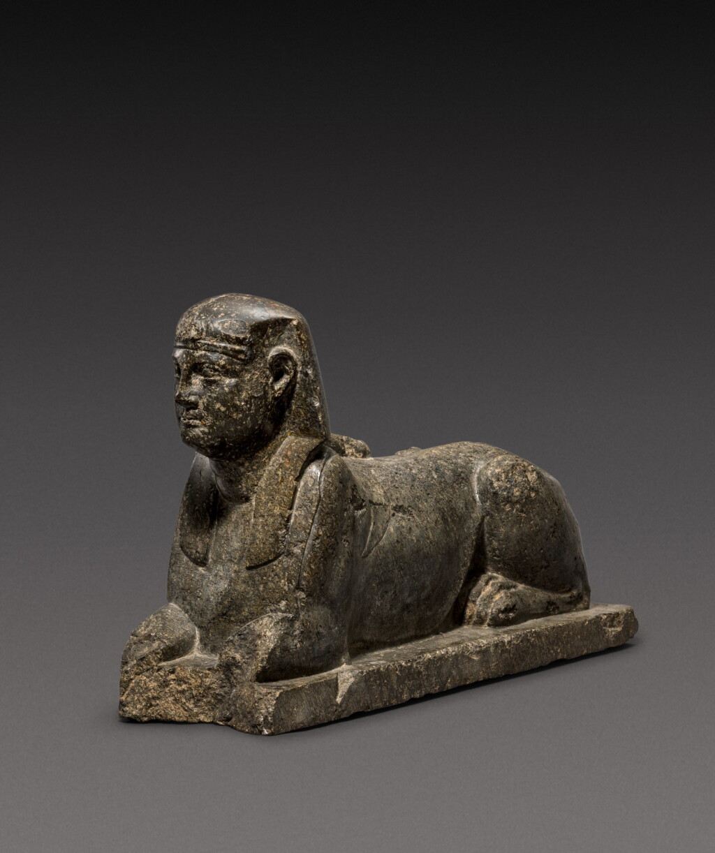 View full screen - View 1 of Lot 44. An Egyptian Figure of a Sphinx, Ptolemaic Period, 305-30 B.C..