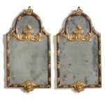 A PAIR OF ITALIAN EARLY ROCOCO STYLE SILVERED AND GILTWOOD MIRRORS