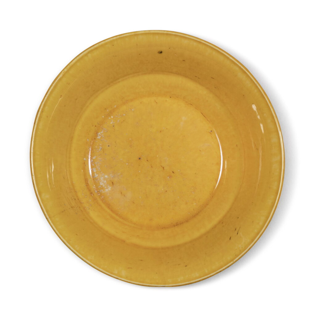 View full screen - View 1 of Lot 243. A small yellow-glazed dish, Mark and period of Jiajing | 明嘉靖 黃釉小盤 《大明嘉靖年製》款.