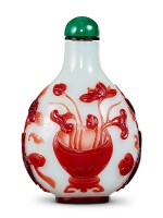 A ruby-red overlay white glass 'lotus' snuff bottle Qing dynasty, 18th – 19th century 清十八至十九世紀 涅白地套寶石紅料荷花盆景鼻煙壺