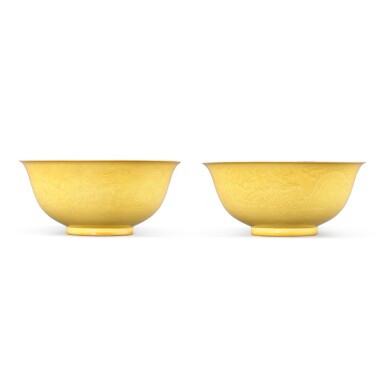 View full screen - View 1 of Lot 9359. A pair of yellow-glazed incised 'dragon' bowls, Mark and period of Guangxu | 清光緒 黃釉暗花雲龍趕珠紋盌一對 《大清光緒年製》款.