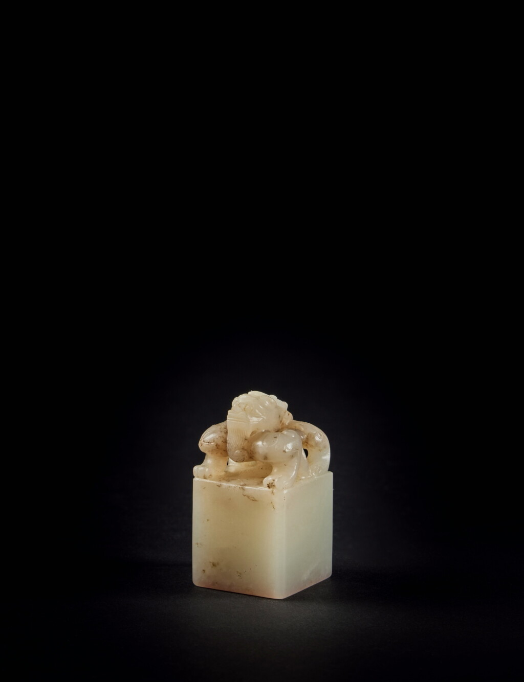 View full screen - View 1 of Lot 175. An important and rare imperial white and beige jade 'Chilong' seal, Qing dynasty, Daoguang period .