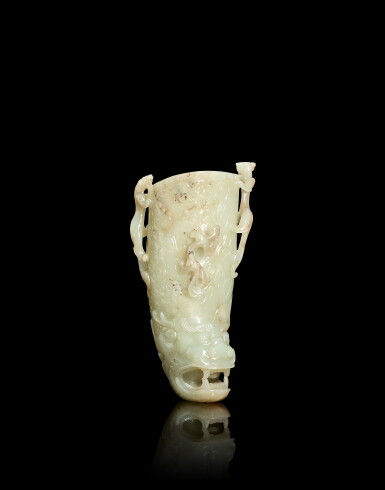 View full screen - View 1 of Lot 3812. A pale celadon and russet jade 'chilong' rhyton, Qing dynasty, 17th - 18th century | 清十七至十八世紀 青白玉螭龍花插.