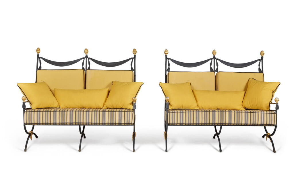 View full screen - View 1 of Lot 183. A Pair of Grey/Black Painted and Parcel Gilt Wrought Iron Settees, Supplied by JP Molyneux Studio Ltd.