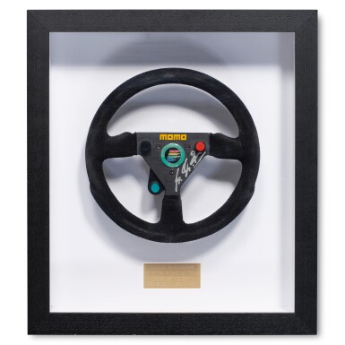 View full screen - View 1 of Lot 26. Michael Schumacher 1992 Benetton B192 Race Used and Signed Steering Wheel | Attributed to 1st Career Grand Prix Victory | Team Benetton Letter of Provenance.