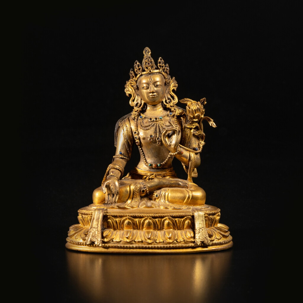 View full screen - View 1 of Lot 648. A gilt copper alloy figure of White Tara, Qing dynasty, 18th century.