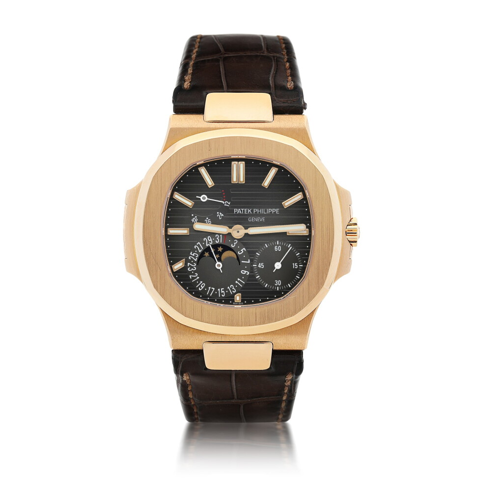 View full screen - View 1 of Lot 8. PATEK PHILIPPE | REFERENCE 5712 NAUTILUS A PINK GOLD AUTOMATIC WRISTWATCH WITH DATE, POWER RESERVE INDICATION AND MOON PHASES, CIRCA 2011.