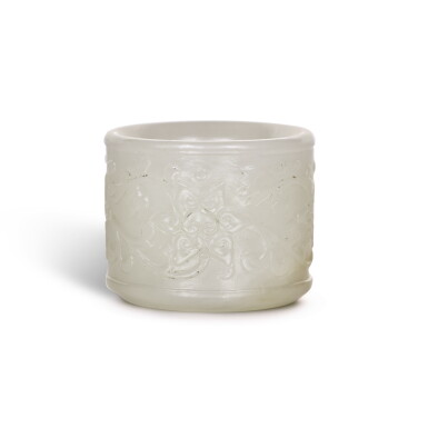 View full screen - View 1 of Lot 212. A WHITE JADE THUMB RING, QING DYNASTY, 18TH CENTURY | 清十八世紀 白玉纏枝蓮紋扳指.