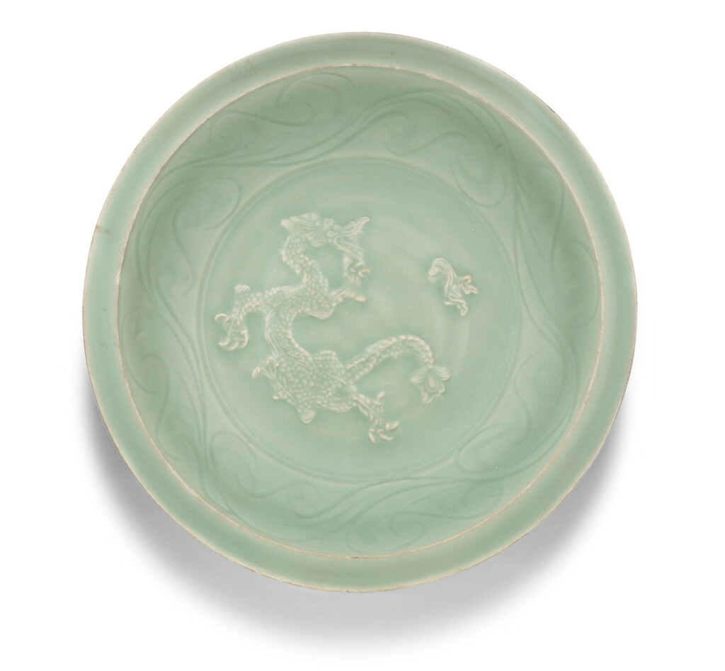 View full screen - View 1 of Lot 365. A LARGE 'LONGQUAN' CELADON 'DRAGON' DISH, EARLY MING DYNASTY | 明初 龍泉青釉貼花龍紋折沿盤.