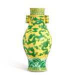 A very rare yellow-ground green-enamelled 'dragon' vase, Mark and period of Yongzheng | 清雍正 黃地綠彩海水雲龍雙貫耳橄欖瓶 《大清雍正年製》款
