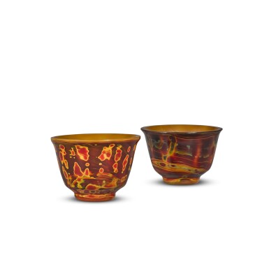 View full screen - View 1 of Lot 28. A pair of small imitation realgar glass cups, Qing dynasty, 18th century | 清十八世紀 仿雄黃料小盃一對.