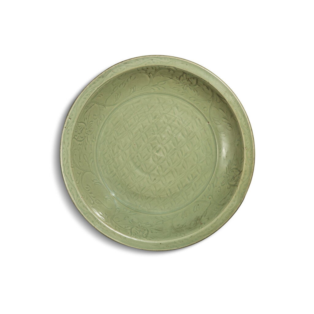 View full screen - View 1 of Lot 232. A large carved ‘Longquan’ celadon-glazed charger, Ming dynasty, 15th century | 明十五世紀 龍泉窰青釉刻花錦文折沿大盤.