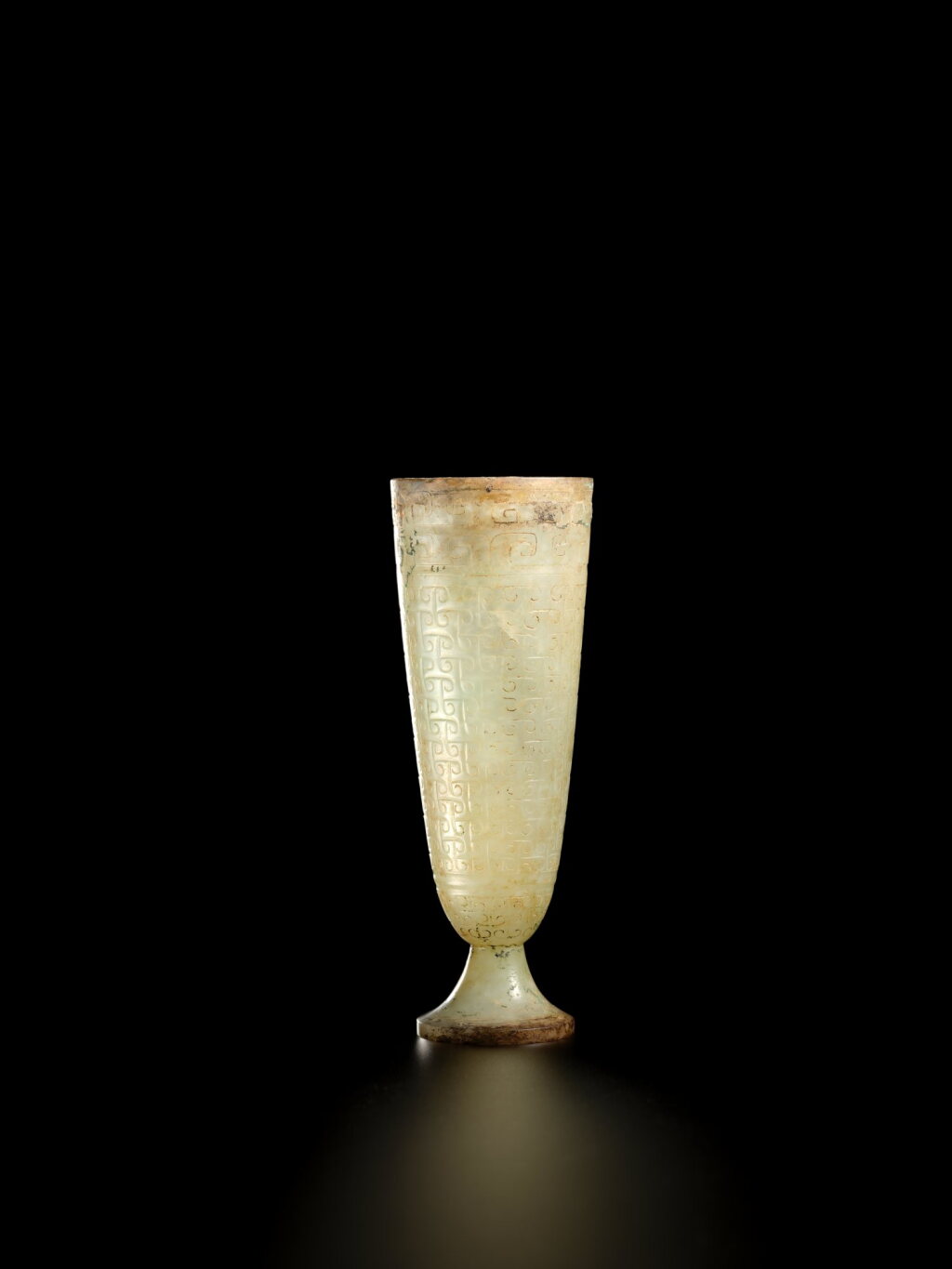 View full screen - View 1 of Lot 3759. An extremely rare jade stem cup, Western Han Dynasty | 西漢 白玉勾連雲紋高足盃.