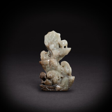View full screen - View 1 of Lot 9487. A pale celadon jade 'lion' boulder, Ming dynasty | 明 青白玉瑞獅山子.