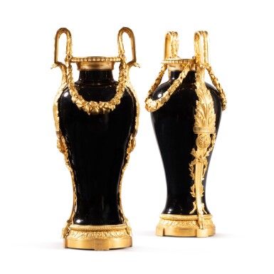 View full screen - View 1 of Lot 555. A pair of gilt-bronze-mounted Chinese ‘Mirror Black’ porcelain vases, the porcelain Kangxi (1662-1722), the mounts Louis XVI, circa 1785, possibly by Pierre Gouthière, possibly after a design by François-Joseph Bélanger or Jean-Demothène Dugourc.