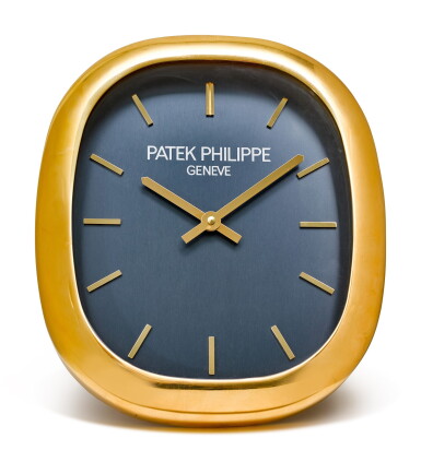 View full screen - View 1 of Lot 192. PATEK PHILIPPE | ELLIPSE, A GILT BRASS WALL CLOCK, CIRCA 1990.