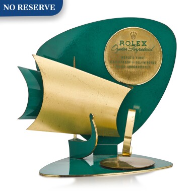 View full screen - View 1 of Lot 8067. ROLEX | OYSTER PERPETUAL A GILT BRASS AND GREEN ENAMEL RETAILER'S WINDOW DISPLAY, CIRCA 1960.