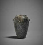 An Egyptian Variegated Gray and Brown Stone Jar, Late Predynastic period/1st Dynasty, circa 3300-2900 B.C.