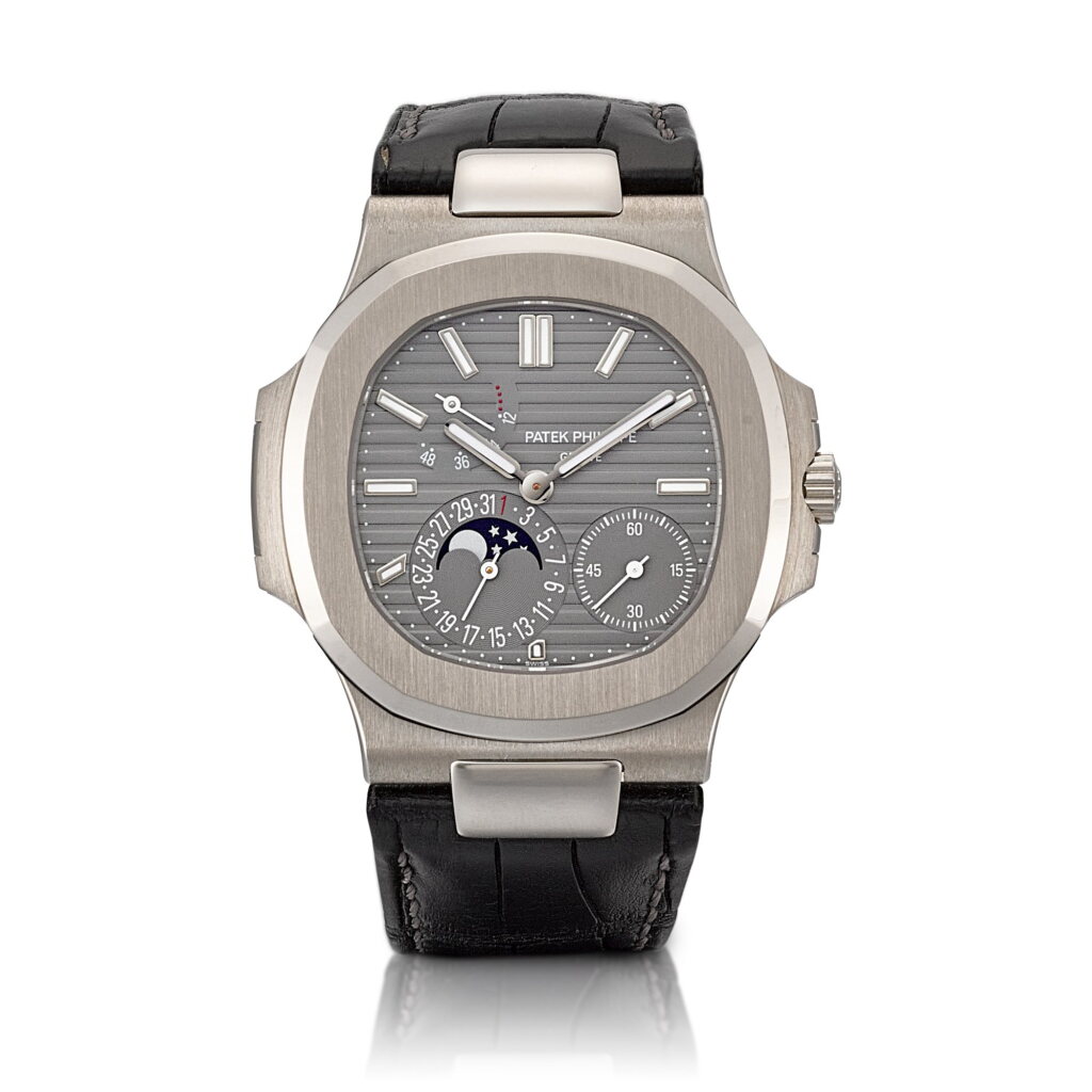 View full screen - View 1 of Lot 2337. Nautilus, Reference 5712 | A white gold wristwatch with date, moon phases and power reserve indication, Circa 2010 | 百達翡麗 | Nautilus 型號5712 | 白金腕錶,備日期、月相及動力儲備顯示,約2010年製.
