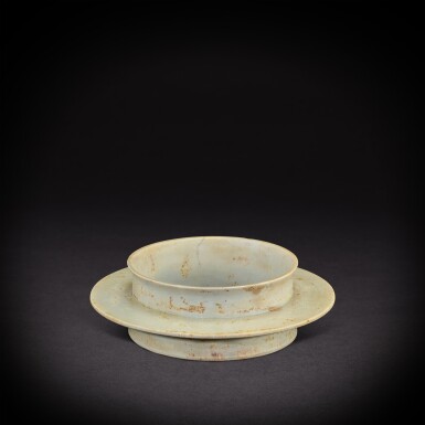 View full screen - View 1 of Lot 3490. A calcified jade collared disc, bi, Shang dynasty | 商 玉有領璧.