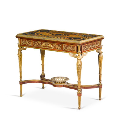 View full screen - View 1 of Lot 118. A French gilt-bronze mounted mahogany centre table, early 20th century, after a model by Adam Weisweiler.