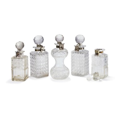 View full screen - View 1 of Lot 251. Five Late Victorian Cut-Glass Tantalus Decanters and Stoppers, Late 19th Century.