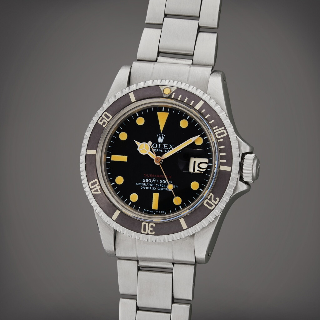View full screen - View 1 of Lot 71. Reference 1680 'Red' Submariner | A stainless steel automatic wristwatch with date and bracelet, Circa 1973.