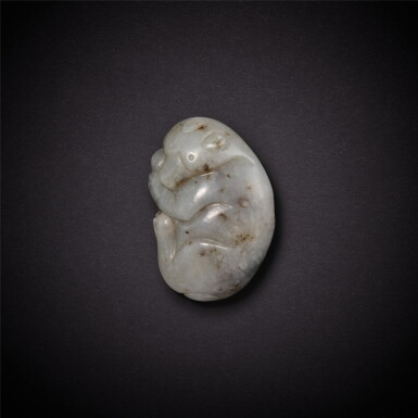 View full screen - View 1 of Lot 3551. A greyish-white jade 'bear' pendant, Song - Jin dynasty | 宋至金 灰白玉臥熊墜飾.
