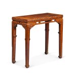 A finely carved and exceedingly rare huanghuali 'dragon' side table, Qing dynasty, Kangxi period | 清康熙 黃花梨夔龍紋束腰條桌